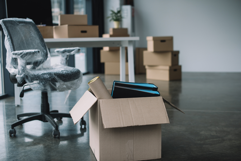 Cardboard,Box,With,Folders,And,Office,Supplies,In,Floor,During